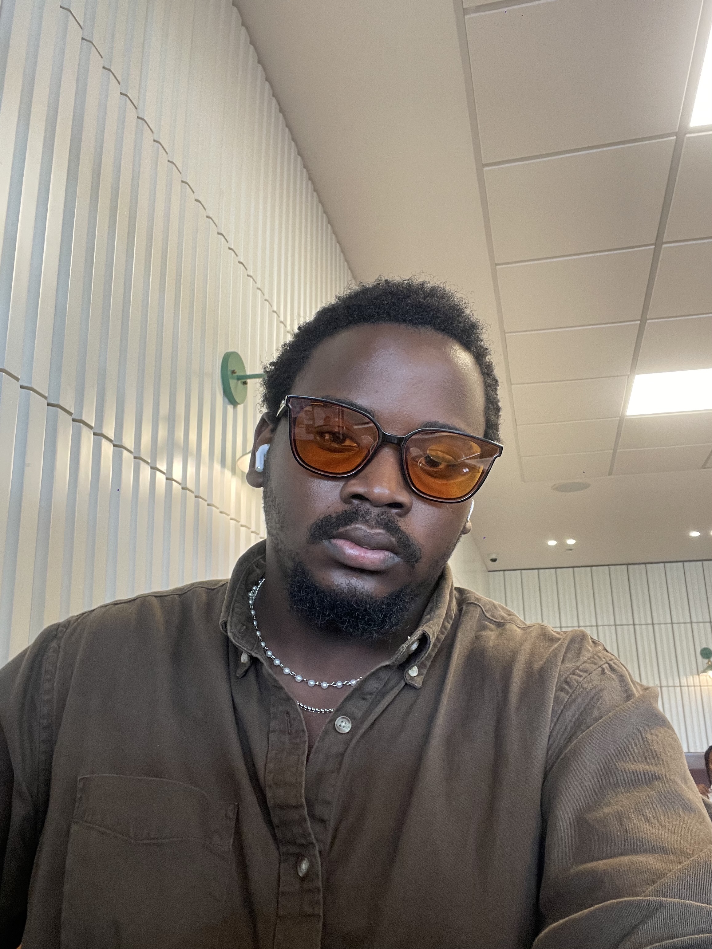 Ojo Ayotunde (Colored Savage) - Creative Director and Designer
